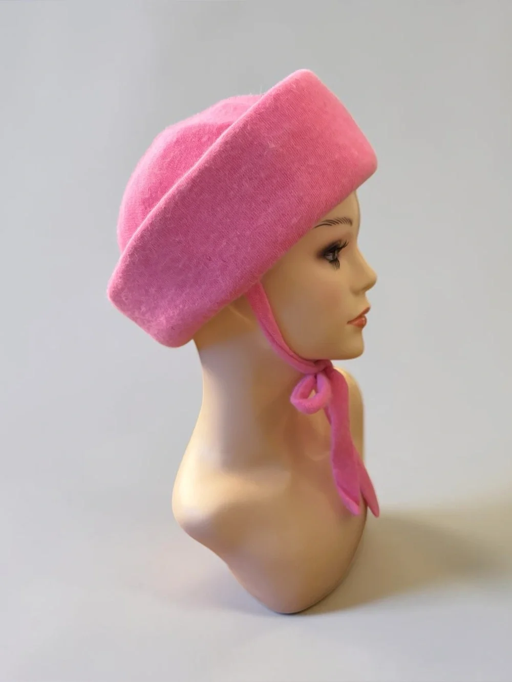 Rivera pink wool pillbox hat with integrated chin ties
